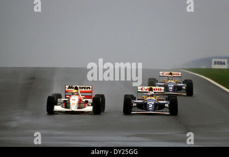 (L-R) Ayrton Senna (McLaren), Alain Prost, Damon Hill (Williams), APRIL 1993 - F1 : Ayrton Senna of McLaren-Ford takes the lead from Alain Prost of Williams-Renault on the first lap of the 1993 European Grand Prix at Donington Park in England. Behind them is Damon Hill. © Grand Prix Photo/AFLO/Alamy Live News Stock Photo