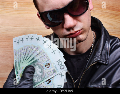 Chief boss mafia gangster thug with stolen money euro Stock Photo