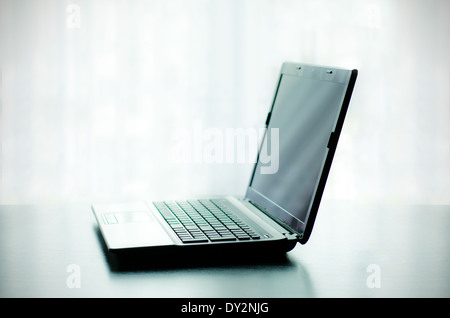 Modern laptop on desk Stock Photo