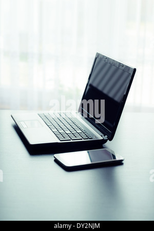 Modern laptop and tablet in office Stock Photo
