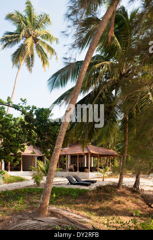 Beach house retreat set in coconut palms in the Indian state of Goa Stock Photo