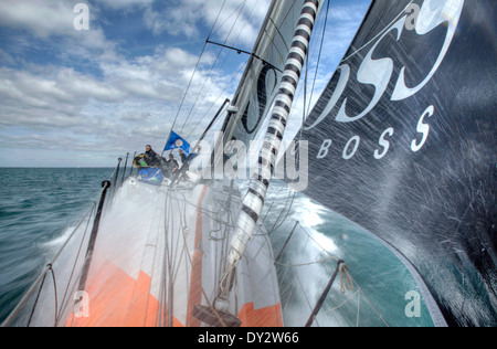 Onboard Hugo Boss  racing around the Isle of Wight in the Artemis Challenge. Skipper Alex Thomson & Crew along with celebrity Ew Stock Photo