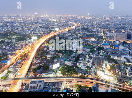 Bangkok, Thailand, Southeast Asia. The city at dusk seen from the State Tower, Silom District Stock Photo