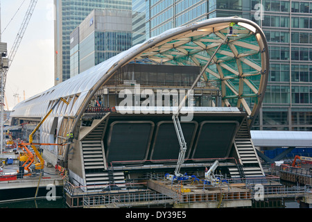 Canary Wharf crossrail train station named Elizabeth Line superstructure under construction office blocks beyond Stock Photo