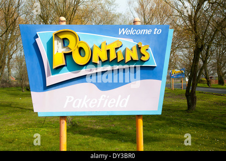 Sign for Pontin's holiday camp at Pakefield, near Lowestoft, Suffolk, England some vandalism damage to lettering Stock Photo