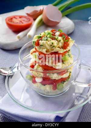 Herb omelette stack cooked in a glass cup individual portion Stock Photo