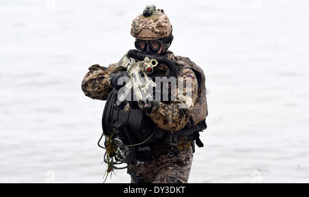 Eckernfoerde, Germany. 05th Apr, 2014. German commando frogmen show the ...