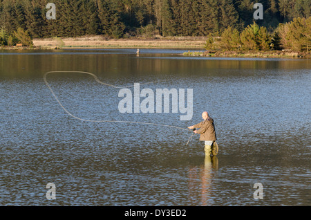 Fly fishing at Cogra Moss on a sunny Spring evening Stock Photo