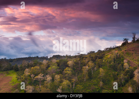 Colorful skies at dusk over the hills between the villages Rio Sereno and Volcan, Chiriqui province, Republic of Panama. Stock Photo