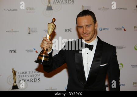 Dublin, Ireland. 5th April 2014. Irish-German actor Michael Fassbender presents his IFTA award for Best Supporting Actor Film for his role in the film '12 Years A Slave'. Over 20 awards have been handed out at the 11th Irish Film & Television Awards ceremony in Dublin. The Irish President Michael D. Higgins has received an Outstanding Contribution Honorary Award for his contributions to the Irish film and TV industry. Credit:  Michael Debets/Alamy Live News Stock Photo