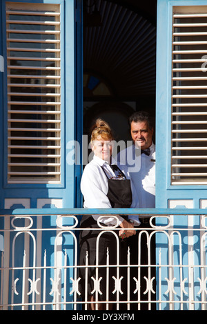 Waitress and waiter standing on balcony Hotel Mascotte Remedios Cuba Stock Photo