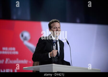 Panama City, Panama. 5th Apr, 2014. Mexican director Amat Escalante, reacts after receiving the Best Director Award, during the first edition of the Ibero-American Cinema Platinum Awards, in Panama City, capital of Panama, on April 5, 2014. Credit:  Mauricio Valenzuela/Xinhua/Alamy Live News Stock Photo