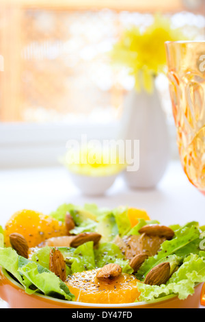 Summery Citrus Salad with almonds and lemon poppy seed dressing Stock Photo
