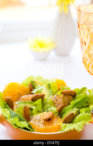 Summery Citrus Salad with almonds and lemon poppy seed dressing Stock Photo