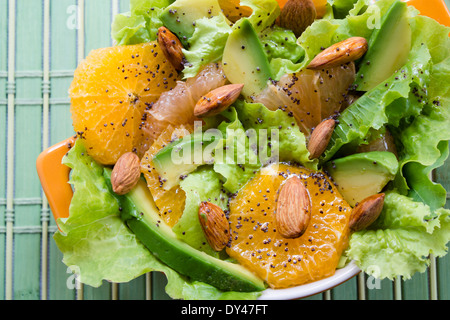 Summery Citrus Salad with almonds and lemon poppy seed dressing Stock Photo