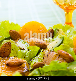 Summery Citrus Salad with almonds and lemon poppy seed dressing Stock Photo