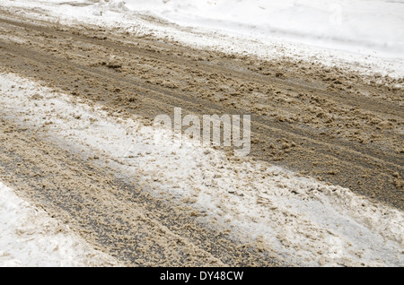slushy winter road with hazardous driving conditions Stock Photo