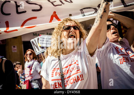 Barcelona, Spain. April 6th, 2014: A protestor shouts slogans during a march for a social Catalonia through the city of Barcelona. Credit:  matthi/Alamy Live News Stock Photo