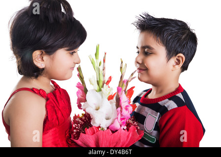 Indian Kids Couple Bouquet  Presents Stock Photo