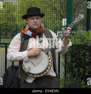 street musician playing banjo. London busker. Stock Photo