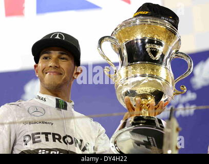 Manama, Bahrain. 06th Apr, 2014. Mercedes' Lewis Hamilton celebrates after the final of Formula 1 Bahrain Grand Prix in Manama, Bahrain, on April 6, 2014. Hamilton won the title with 1 hour 39 minutes and 42.743 seconds.  Credit:  Hasan Jamali/Xinhua/Alamy Live News Stock Photo
