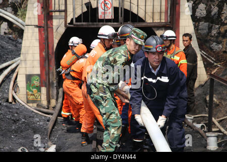 Qujing, China's Yunnan Province. 7th Apr, 2014. Rescuers conduct rescue operation at the flooded Xiahaizi coal mine in Dongshan Town of Qujing City, southwest China's Yunnan Province, April 7, 2014. Twenty-two out of the 26 workers have been trapped by the flood happening early Monday. © Ren Jun/Xinhua/Alamy Live News Stock Photo