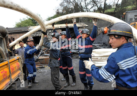 Kunming, China's Yunnan Province. 7th Apr, 2014. Rescuers work at the flooded Xiahaizi coal mine in Dongshan Town of Qujing City, southwest China's Yunnan Province, April 7, 2014. 22 workers have been trapped by a flood happening at the mine early Monday. © Chen Haining/Xinhua/Alamy Live News Stock Photo