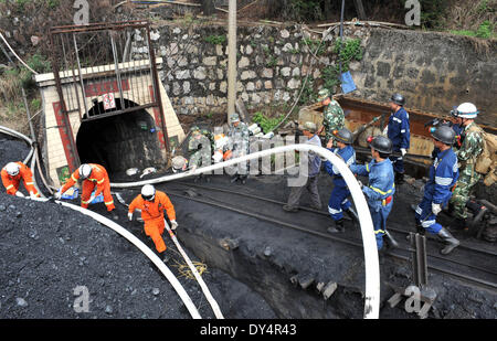 Kunming, China's Yunnan Province. 7th Apr, 2014. Rescuers work at the flooded Xiahaizi coal mine in Dongshan Town of Qujing City, southwest China's Yunnan Province, April 7, 2014. 22 workers have been trapped by a flood happening at the mine early Monday. © Chen Haining/Xinhua/Alamy Live News Stock Photo