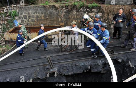 Kunming, China's Yunnan Province. 7th Apr, 2014. Rescuers work at the flooded Xiahaizi coal mine in Dongshan Town of Qujing City, southwest China's Yunnan Province, April 7, 2014. 22 workers have been trapped by a flood happening at the mine early Monday. © Chen Haining/Xinhua/Alamy Live News Stock Photo