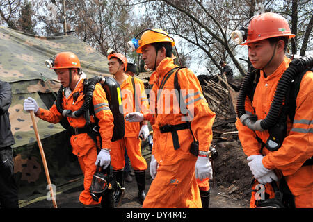 Kunming, China's Yunnan Province. 7th Apr, 2014. Rescuers work at the flooded Xiahaizi coal mine in Dongshan Town of Qujing City, southwest China's Yunnan Province, April 7, 2014. 22 workers have been trapped by a flood happening at the mine early Monday. © Chen Haining/Xinhua/Alamy Live News Stock Photo