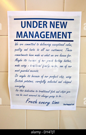 Sign reading under new management in a fish and chip shop Stock Photo