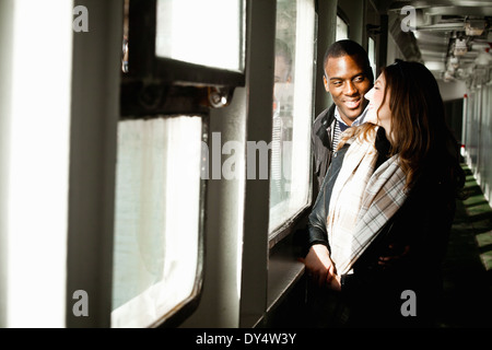 Young couple chatting in shelter Stock Photo