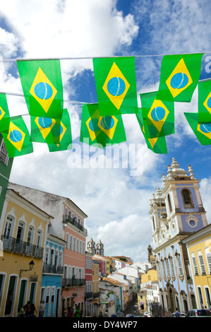 Brazilian flag bunting fluttering over historic city center colonial architecture of Pelourinho Salvador da Bahia Brazil Stock Photo