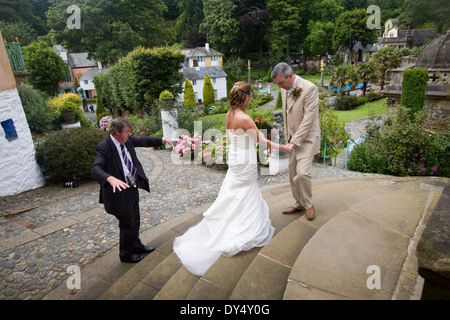 Bride and Groom with photographer, ornamental gardens, Portmeirion, Wales, United Kingdom Stock Photo