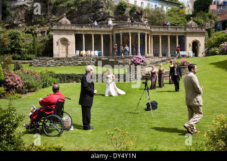 Wedding reception in gardens, man in wheelchair, Portmeirion, Wales, United Kingdom Stock Photo