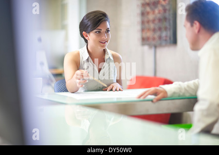 Young businesswoman meeting client in office