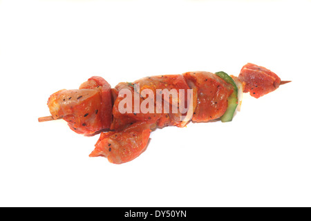 raw, marinated skewered meat in front of white background Stock Photo