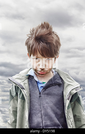 Boy with muddy face Stock Photo