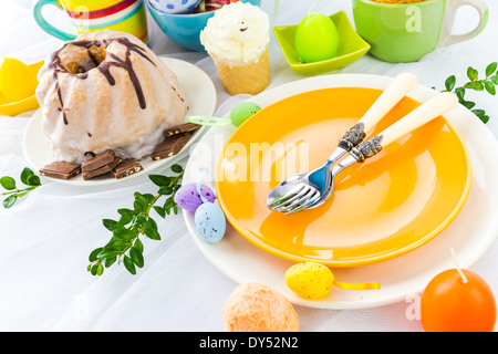 Easter table arrangement with eggs and sweets Stock Photo