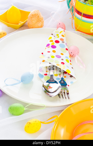 Easter table setting with silverware wrapped in a napkin Stock Photo