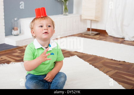 Baby boy playing with plastic toys Stock Photo