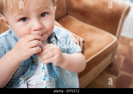 Baby boy drinking milk Stock Photo