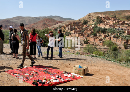 Roadside viewpoint by village of Tahnaout (on R203 road out of Marrakech) with men offering souvenirs Stock Photo