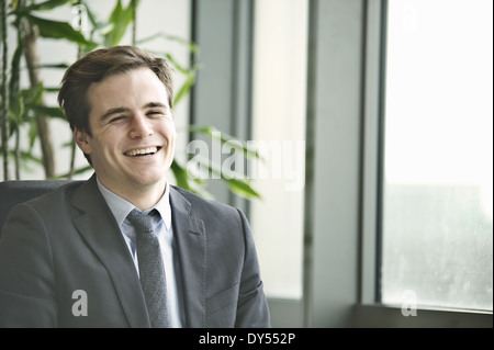 Portrait of young businessman at office desk Stock Photo