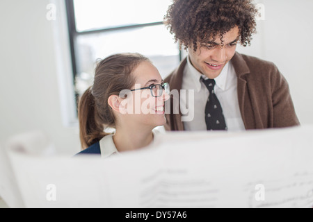 Two colleagues discussing blueprint Stock Photo