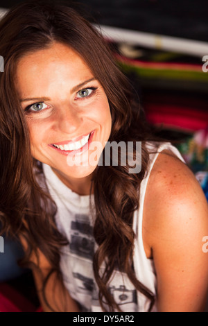 Young woman with long brown hair smiling Stock Photo