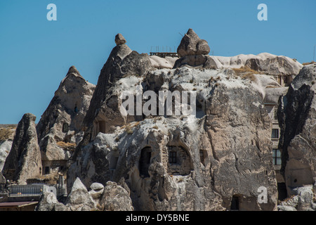 Goreme, located among the 'fairy chimney' rock formations, is a town in Cappadocia, a historical region of Turkey. Stock Photo