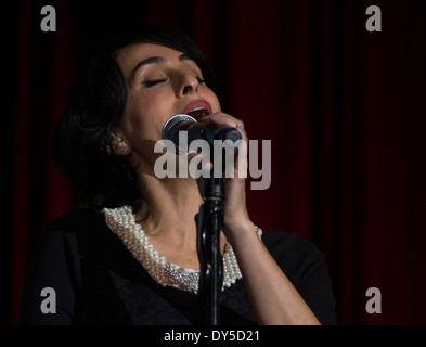 NEW YORK, NY - APRIL 06, 2014: Israeli singer Rita performs at Jerusalem Post Annual Conference in Marriott Marquis Times Square Stock Photo