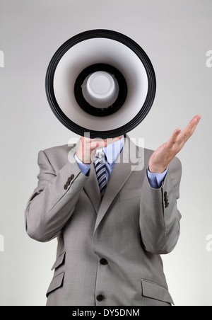 Businessman shouting through a megaphone Stock Photo