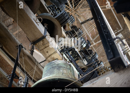 BRUGES, Belgium - Some of the many Carillon bells that chime in the tower of the Belfry of Bruges. The Belfry (or Belfort) is a medieval bell tower standing above the Markt in the historic center of Bruges. The first stage was built in 1240, with further stages on top built in the late 15th century. The Carillon consists of 47 bells. 26 bells were cast by Georgius Dumery between 1742 and 1748 and 21 bells were cast by Koninklike Eijsbouts in 2010. The bourdon weights 6 tons, and the bells have a combined weight of 27 tons. Stock Photo
